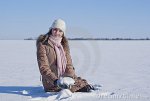 teen-girl-sitting-snow-18103193.jpg