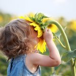 child-smelling-flower.jpg