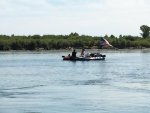 Boat floating down river.jpg