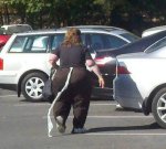 toilet-paper-hanging-from-pants-fat-woman-walmart-awkward-family.jpg